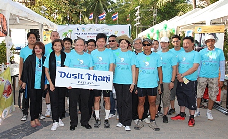 Dusit general manager, Chatchawal Supachayanont, third left, stands with Dr. Jirapol Sinthunava of the Green Leaf Foundation, fourth left, and other riders at the Pattaya Midnight Bike ride on Saturday, April 30.